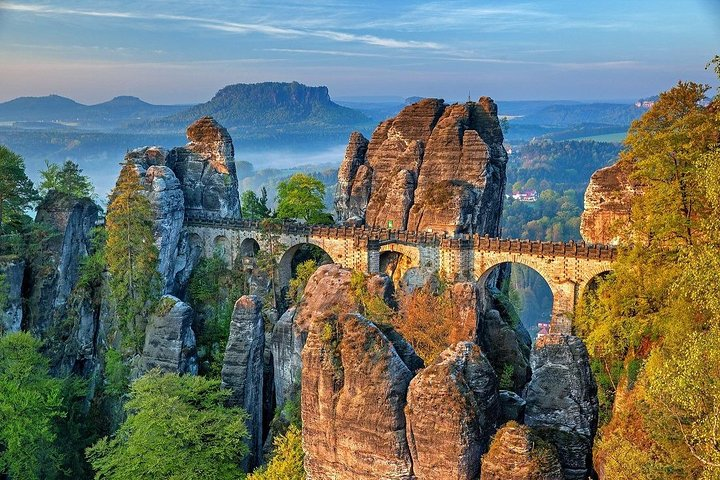 Explore the stunning rock formations and historical bridge that connect nature and architecture offering a unique perspective of Prague’s captivating landscape for every traveler.
